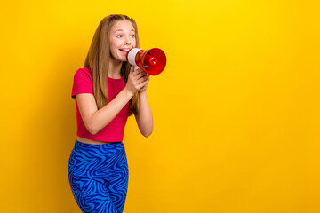 Poster - Photo of adorable good mood schoolgirl pink t-shirt showing v-sign hold loudspeaker look empty space isolated on yellow color background