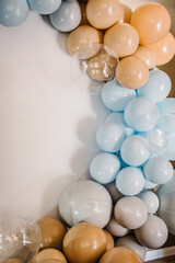 Wall Mural - Details. Arch decorated with blue, brown, grey balloons. Photo-wall decoration space, place for text on white background. Wedding reception. Trendy decor. Celebration baptism concept. Birthday party.