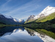 © robertharding - A view of snow-covered mountains and reflections in Lake Oldevatnet, within the Oldedalen River Valley, Vestland, Norway, Scandinavia, Europe
