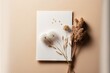  a card with dried flowers on it on a table next to a vase of dried flowers on a white card with a pink background and a white envelope.  generative ai