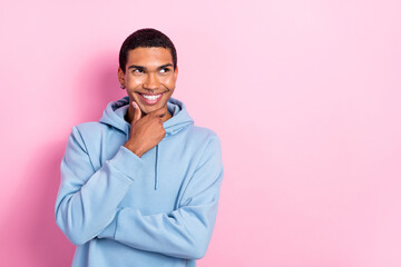 Wall Mural - Photo of cheerful minded person arm touch chin beaming smile look interested empty space ad isolated on pink color background