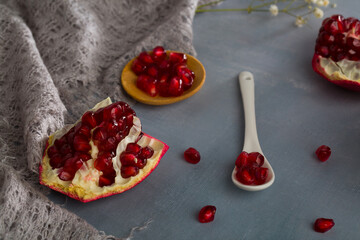 Wall Mural - Red juice pomegranate composition on green background