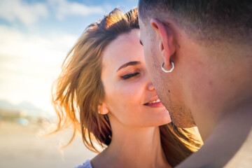 Wall Mural - Happy young couple at the sea vacations