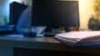 © Klochkov - Blurred background of office space. Desktop wallpaper with notepad and blurry computer. Widescreen wallpaper with a blurry office space