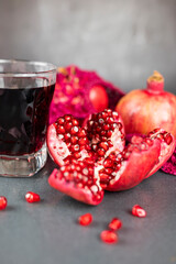 Wall Mural - delicious healthy fruit pomegranate red with juice in a glass