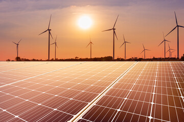 Wall Mural - wind turbine and solar panel in sunset.renewable energy to businesses, homes, and public buildings.s