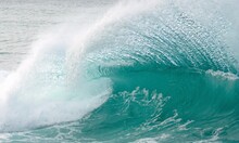 A Wave Curls Toward The Shore During A High Surf Advisory Off The Ko Olina Coast On Oahu's Western Shore.                               