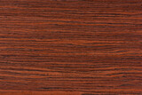 Fototapeta Las - Rosewood texture. Texture of dark mahogany with an intense pattern, natural rosewood veneer for the production of furniture or yacht decoration