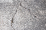 Fototapeta Desenie - Cracked gray concrete pavement texture