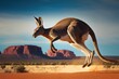 Side view of a close-up of a jumping kangaroo with mountains in the background. Created with Generative AI technology.