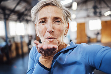 Poster - Senior woman, blowing kiss and fitness selfie at gym while happy after exercise, training or workout. Portrait of old person with smile for health, wellness and motivation for healthy lifestyle goals