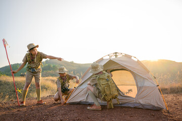 thai boy scout students attend boy scout camp on the mountain with good teamwork helping each other 