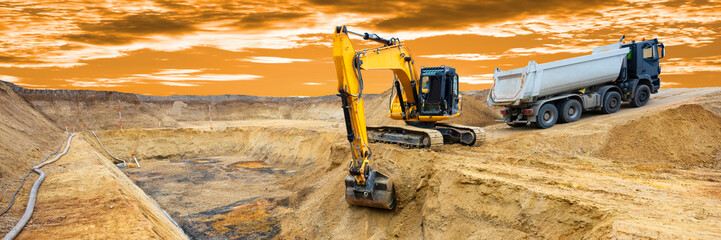 excavator is working and digging at construction site