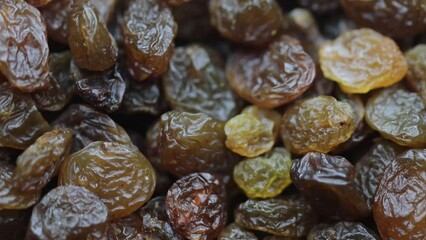 Poster - dried fruits. natural raisins rotate in circle