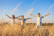© Victor - Three kids with open arms in the countryside at summer