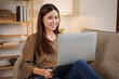 © Katcha - Female entrepreneur reading new business project and typing data