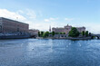 Norrström (lake Mälaren's primary outlet in the Baltic Sea in central Stockholm) with the Royal Palace on the left, Sweden's Parliament house and the medieval museum straight ahead.
