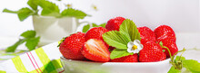 Strawberries In White Porcelain Bowl On A Table. Bowl Filled With Juicy Fresh Ripe Red Strawberries. Banner With Selective Focus