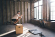 © BullRun - Serious man doing exercise on jump box in gym