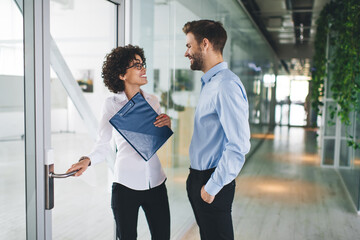 Millenial business man and woman working in office