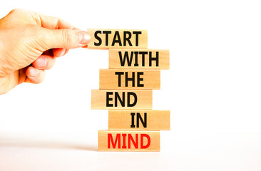 Wall Mural - Start in end of mind symbol. Concept words Start with the end in mind on wooden blocks. Beautiful white table white background. Businessman hand. Business start in end of mind concept. Copy space.