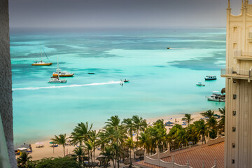 Wall Mural - Beach with palapa on Aruba island in the Caribbean Sea, Dutch Antilles