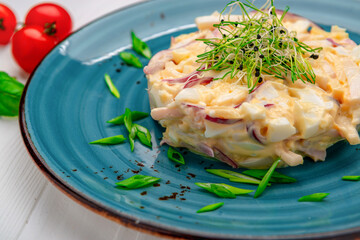 Sticker - Egg salad with onions on a bright plate.