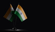 Small national flags of the India on a black background