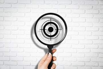 Wall Mural - Magnifier glass focuses on image of target icon.