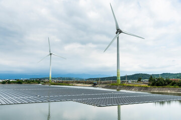 Canvas Print - Combining wind power systems and solar power at Houlong Flood Detention Pond in Miaoli, Taiwan.