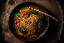Japchae Or Glass Noodles Stir Fried With Vegetables In A Gold Plate, Close Up Of Authentic Korean Food. Daily Or On Chuseok Day, Eat. Generative AI
