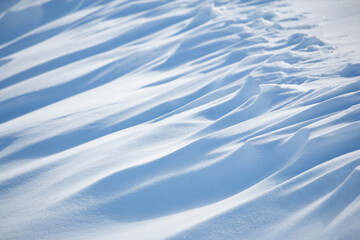Wall Mural - abstract shadow and light patterns in winter snow landscape background