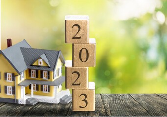 Poster - Toy house model and wooden cubes number 2023