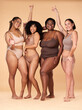 © Nina L/peopleimages.com - Diversity women, celebration and body portrait of friends group together for inclusion, beauty and power. Underwear model people on beige background with cellulite, pride and motivation for self love