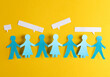 Paper cut chain of people holding hands and speech bubbles on yellow background. Unity concept. Social media
