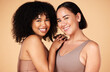 © Nina L/peopleimages.com - Beauty, friends and diversity of women in lingerie in studio isolated on a brown background. Portrait, underwear and face of body positive happy girls with makeup, cosmetics and healthy skincare.