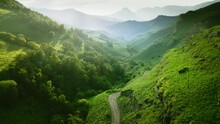 Green mountains in the evening sunlight. Aerial drone view. Summer landscape. Aktoprak pass in North Caucasus, Russia.
