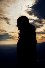 Silhouette Of A Girl During A Beautiful Sunset