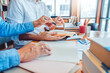 © joyfotoliakid - University students  studying and reading together in library  research homework in college