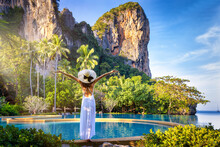 A Summer Travel Concept With A Woman In A White Dress Looking At The Tropical Paradise Beach Of Railay, Krabi, Thailand