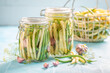 Healthy pickled yellow and green beans with vegetables from greenhouse.