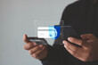 © THAWEERAT - Secure online payment concept. Online shopping and Data encryption. man holding credit card and smartphone doing online banking transaction. E-commerce virtual shopping, secure mobile banking concept.