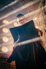 Wall Mural - A buddhist Monk in a pagoda in Bagan Myanmar