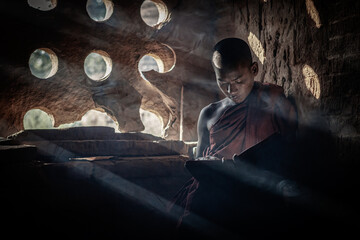 Wall Mural - A buddhist Monk in a pagoda in Bagan Myanmar