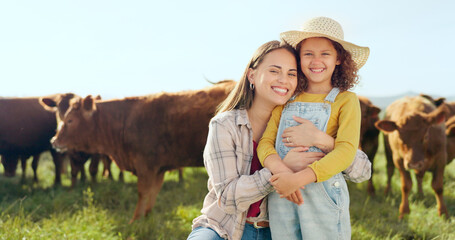 Wall Mural - Farming, child and mother with kiss on a farm during holiday in Spain for sustainability with cattle. Portrait of happy, smile and travel mom and girl with love while on vacation on land with cows