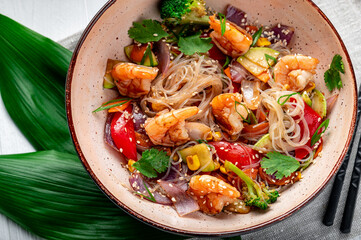 Wall Mural - Rice noodles with shrimp and vegetables. Asian cuisine.