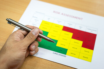 Wall Mural - the project manager is holding a pen, making decision on 
