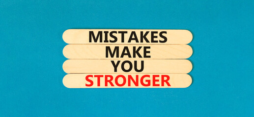 Wall Mural - Mistake make stronger symbol. Concept words Mistakes make you stronger on wooden stick. Beautiful blue table blue background. Business mistake make stronger concept. Copy space.