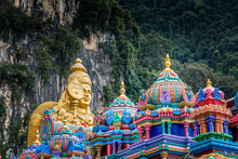 Colorful Saints And A Golden Buddha In Front Of  The Batu Caves, Kuala Lumpur, Malaysia