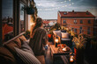 canvas print picture - woman sitting on her cosy balcony with fairy lights in the evening light and looks at the city, generative ai